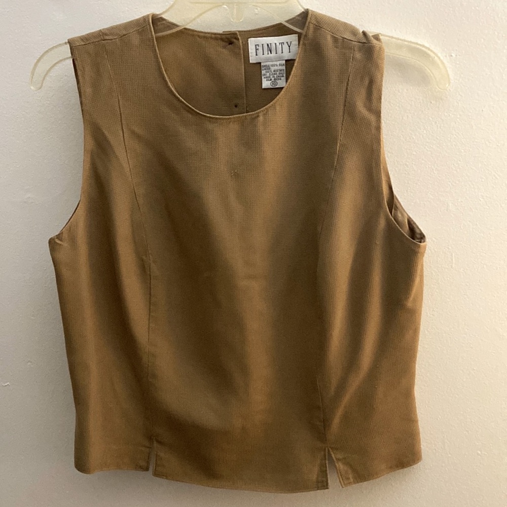 Finity brand size 10, short sleeve, button down in back, completely lined.